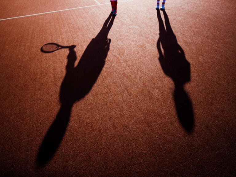 Close Up On People Shadow On Tennis Court