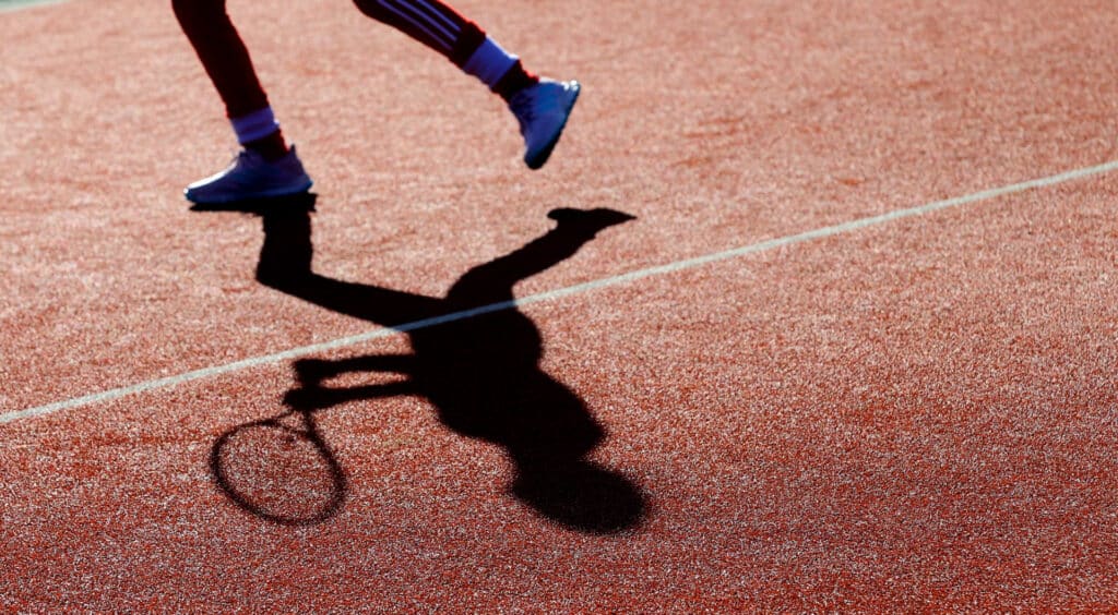 Close Up View Of Person Legs With Shadow
