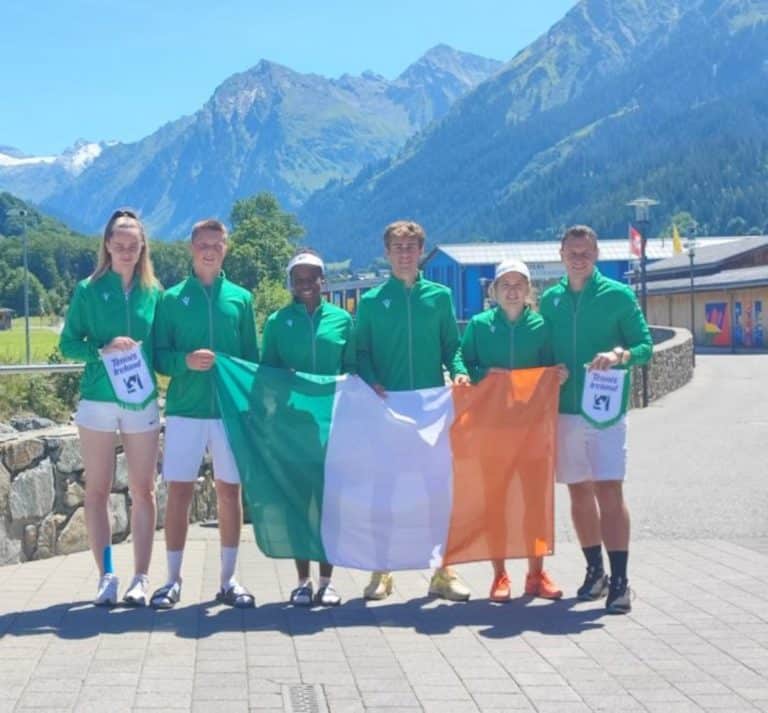 Tennis Ireland Team holding Irish flag