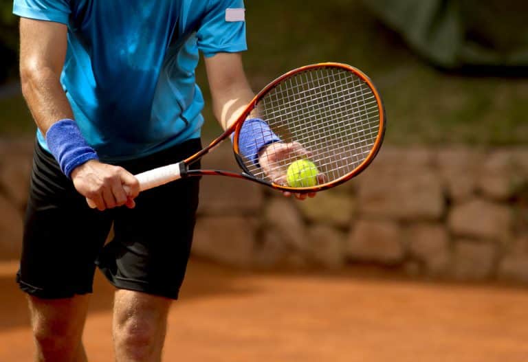 A tennis player preparing to hit the ball