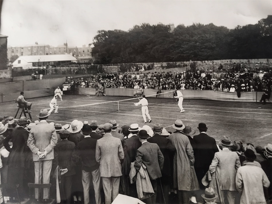 Black and white photo of a tennis match being played in 1923
