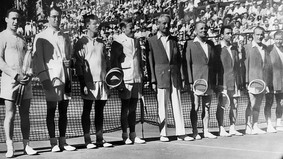 Black and white photo of Irish and Polish tennis teams taken in 1950