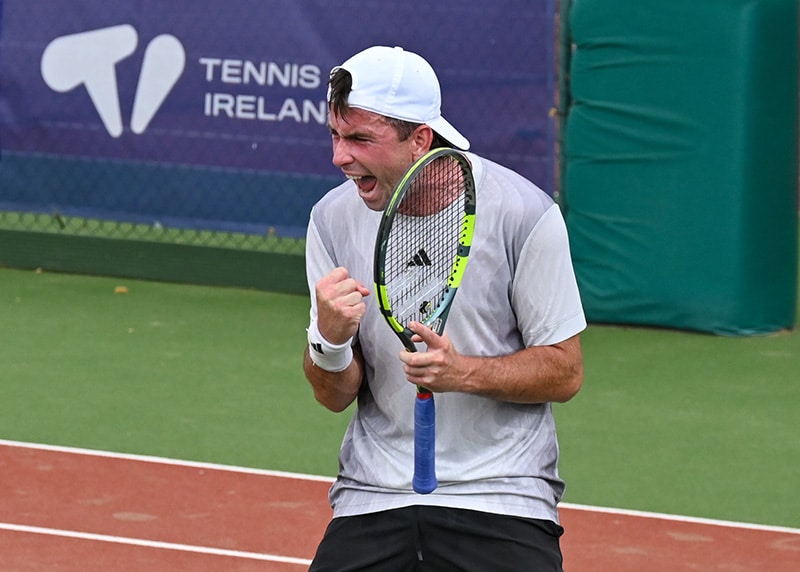 Conor Gannon celebrates during his singles match with Lorenzo Lorusso